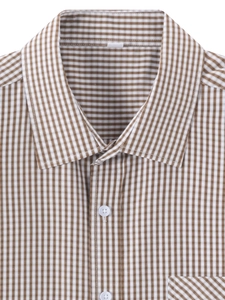 Close-up of classic brown gingham plaid shirt with square collar and white button