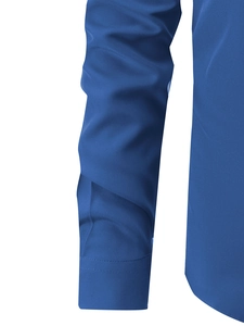 Macro detail of royal blue long sleeve shirt showing fabric texture and neat cuff stitching