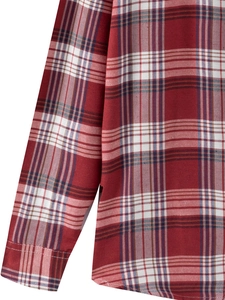 Detailed close-up of red and white plaid fabric with side hem slit and button cuff