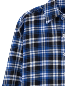 Close-up detail of classic blue and black plaid pattern on long sleeve cotton shirt