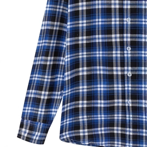 Classic blue and black plaid long sleeve shirt with white buttons and cotton texture