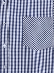 Close-up of a blue and white gingham shirt featuring a diagonal check chest pocket