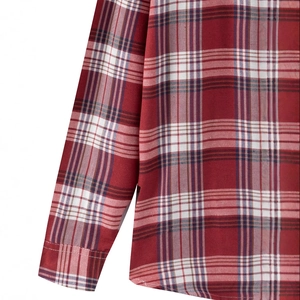 Close-up of classic checkered flannel shirt in dark red and navy blue with fine stitching