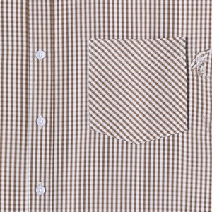 Men's short sleeve plaid shirt in brown and white with detail of bias-cut chest pocket