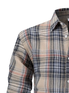 Detailed close-up of khaki plaid dress shirt showing texture and button-down collar