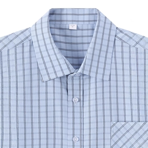 Men's light blue plaid short sleeve button-up business shirt with chest pocket detail
