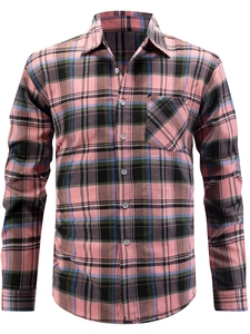 Detail of classic plaid flannel shirt showing textured fabric and front chest pocket