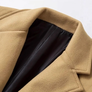 Classic men's camel wool blend trench coat featuring wide lapels and black lining