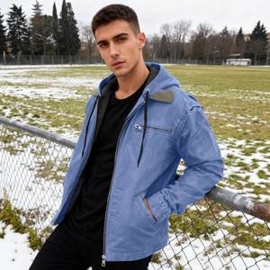 Men's blue hooded work jacket with fleece lining and olive green patch details