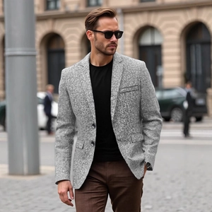 Men's grey textured slim fit blazer with notch lapel and two-button closure outdoors