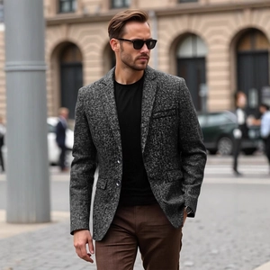 Men's grey textured business casual blazer featuring a notched lapel and two-button closure
