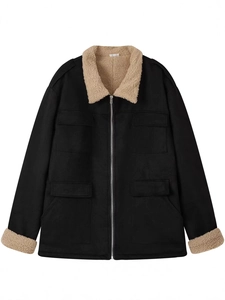 Detail of vintage black utility jacket featuring beige sherpa fleece collar and pockets