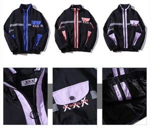 Detail view of streetwear jacket with ring zipper, contrast pockets and text printing