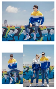 Detail of colorful patchwork hoodie with kangaroo pocket and high-density cotton texture