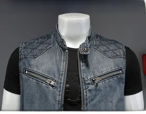Detail view of denim vest featuring diamond quilted shoulders and double zip chest pockets