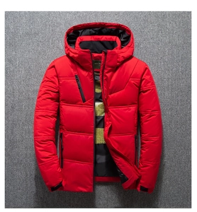 Detail of red hooded down jacket showing black metal zipper and quilted texture
