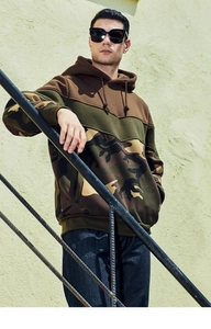 Outdoor shot of men's tricolor hoodie with camouflage panel and kangaroo pocket