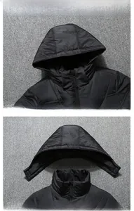 Detail showing the detachable hood and zipper neckline on this black down jacket