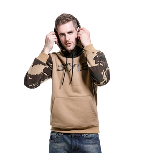 Close-up of camouflage sleeves and black STYLE lettering on the khaki fleece hoodie
