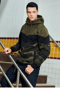 Detail of army green and camouflage color-block hoodie with drawstrings and front pocket