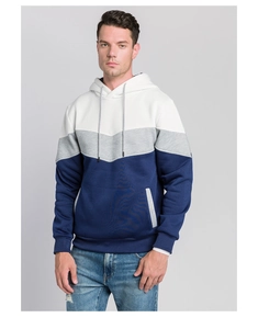 Detail view of color-block camo hoodie featuring ribbed cuffs and front pockets