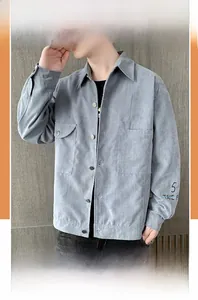 Detailed close-up of light blue corduroy jacket with front pockets and sleeve print