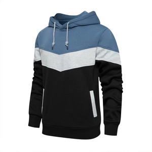 Detail of color-block hooded sweatshirt with V-shaped patchwork design and ribbed cuffs