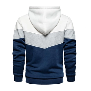 Detail view of the tricolor patchwork design on the back of this hooded sweatshirt