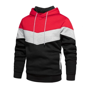 Detail showing the red, grey, and black color-block stitching on the men's hoodie