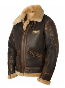 Detail of vintage brown B-3 bomber jacket with eagle badge and faux fur collar