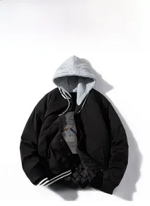 Detail of the diamond quilted lining and gray hoodie on a black baseball jacket