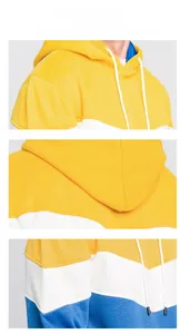 Close-up of three-color patchwork hoodie detailing shoulder and hood construction