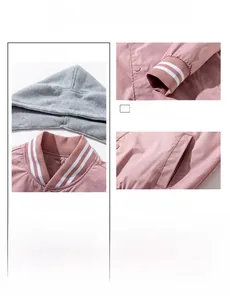 Detail view of pink and grey baseball jacket showing ribbed cuffs and hooded neckline