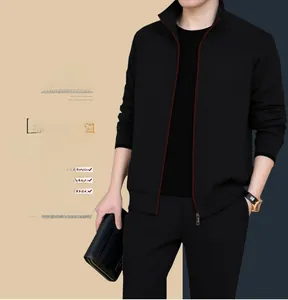 Detail view of men's casual black zip jacket with stand collar and red trim accents