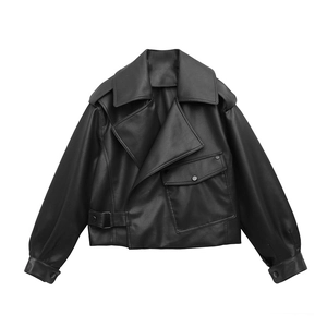 Detail of black faux leather biker jacket featuring wide lapels and large flap pocket