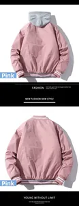 Detailed view of pink bomber jacket with gray detachable hood and rib-knit cuffs