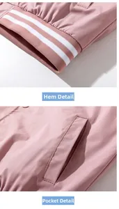 Detail of pink baseball jacket featuring ribbed hem with white stripes and side pockets