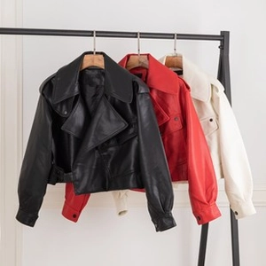 Detailed view of women's oversized faux leather biker jackets in black, red and beige