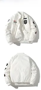 Front and back views of white MA1 bomber jacket with military badges and embroidery