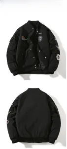 Front and back view of black MA1 bomber jacket with detailed embroidery patches