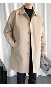 Detailed view of khaki men's trench coat featuring premium lapels and amber buttons