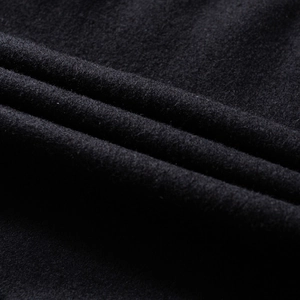 Close-up of premium black wool fabric with soft texture on this retro baseball jacket