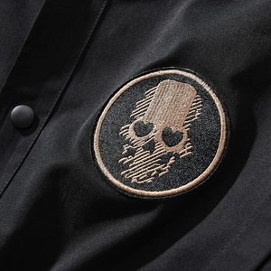 Men's MA1 bomber jacket featuring a detailed gold skull embroidery patch on black fabric