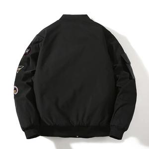 Back view of black MA1 bomber jacket with detailed embroidery patches and ribbed cuffs