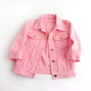 Flat lay of pink slim fit denim jacket with classic collar and double chest pockets
