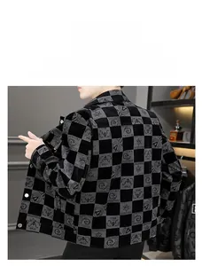 Detailed macro view of men's checkerboard jacket showing corduroy texture and star patterns
