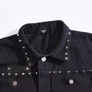 Men's black denim vest featuring silver punk rivets and a slim fit motorcycle style