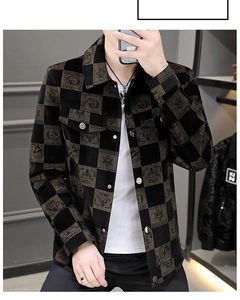 Detail of checkered corduroy jacket featuring star embroidery and vintage metal buttons