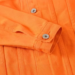 Vibrant orange denim jacket with silver metal buttons and detailed twill cotton texture