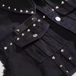Men's black denim motorcycle vest with silver punk studs and raw edge details